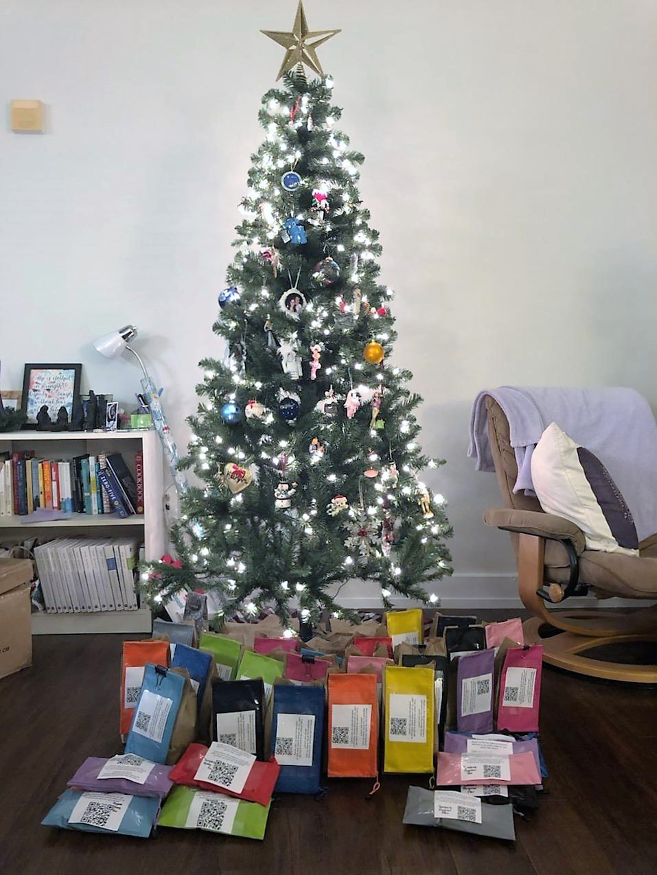 Wrapped period packs arranged around a Christmas tree