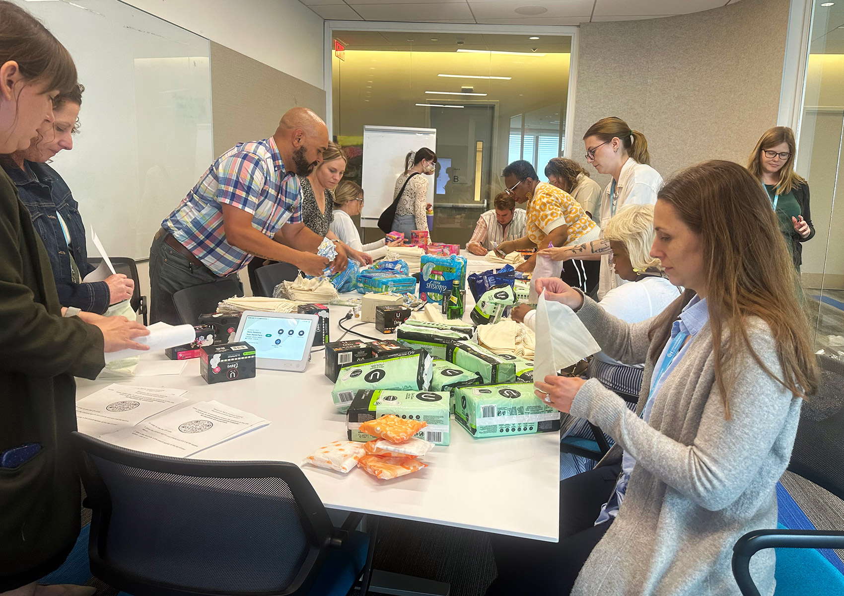 Volunteers assembling period packs