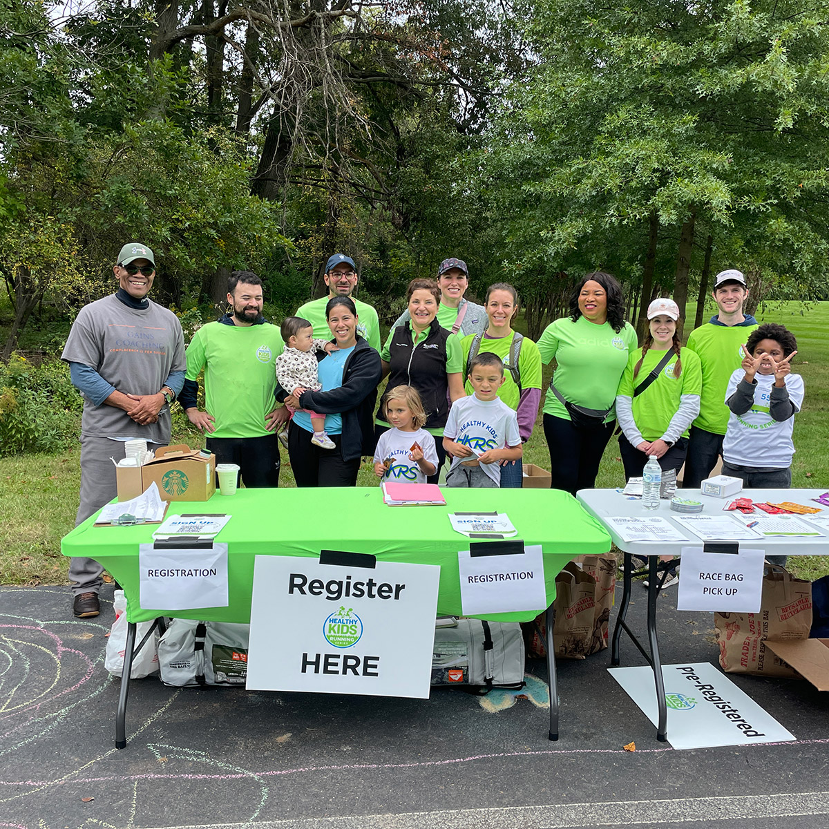 Volunteers standing by a registration table