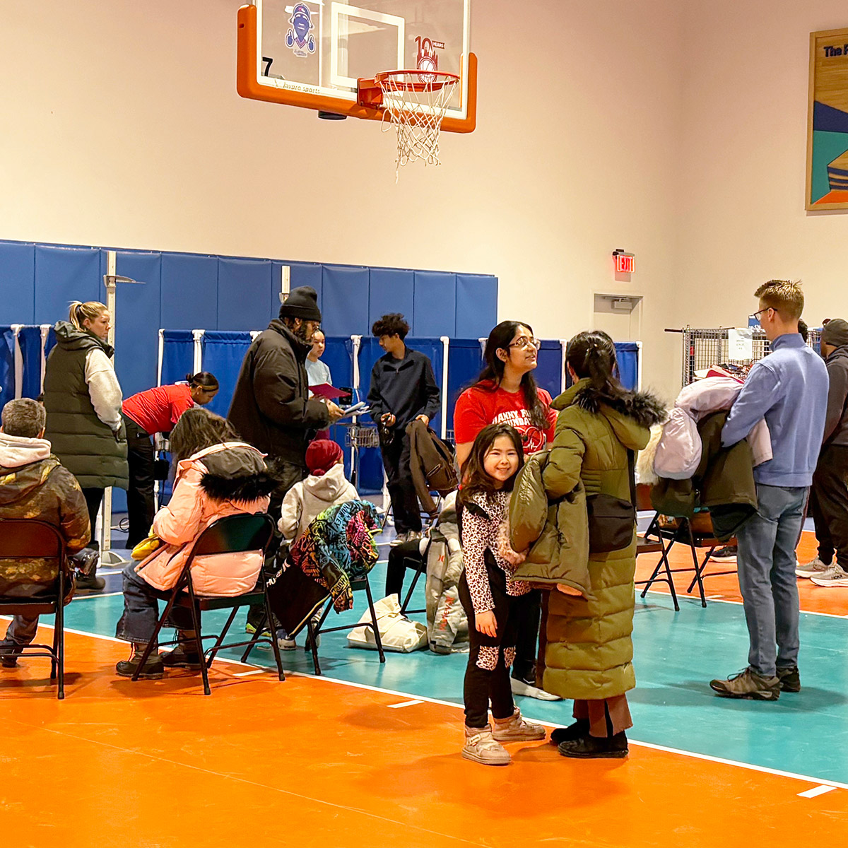 Volunteers and guests attending a Youth Heart Watch event in a school gymnasium